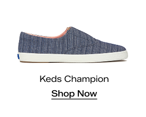 A side view of the Keds Champion Round Toe Stripe Chambray Slip-On in blue. Shop Now