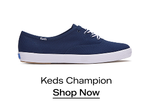 A side view of the Keds Champion canvas Lace-Up in navy. Shop Now