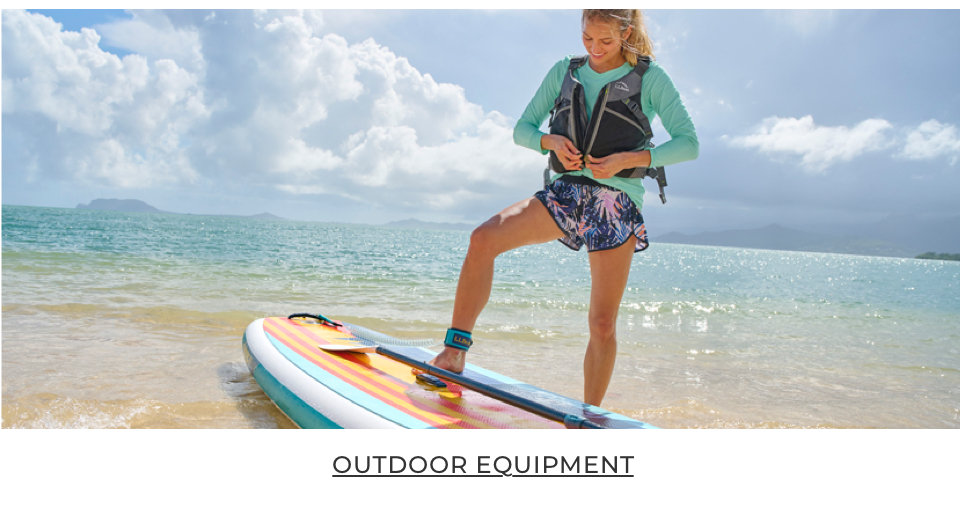 Persona getting ready to go paddleboarding.
