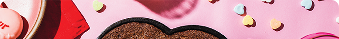 Heart shaped skillet on a Valentine's Day themed background