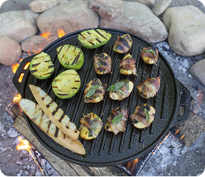 Veggies and bacon wrapped scallops grilling on the Cook-It-All grill pan