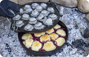 Lid being removed from Cook-It-All to reveal the Mixed Berry Cobbler