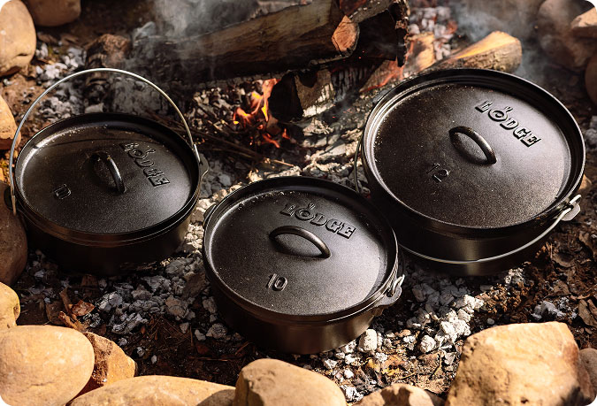 Three different sizes of camp dutch ovens