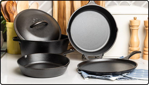 Five-piece cast iron set arranged on a counter