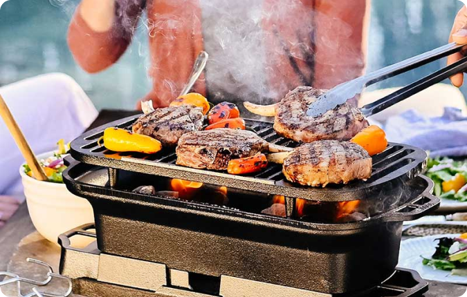The Sportsman's Pro being used to grill chicken and vegetables