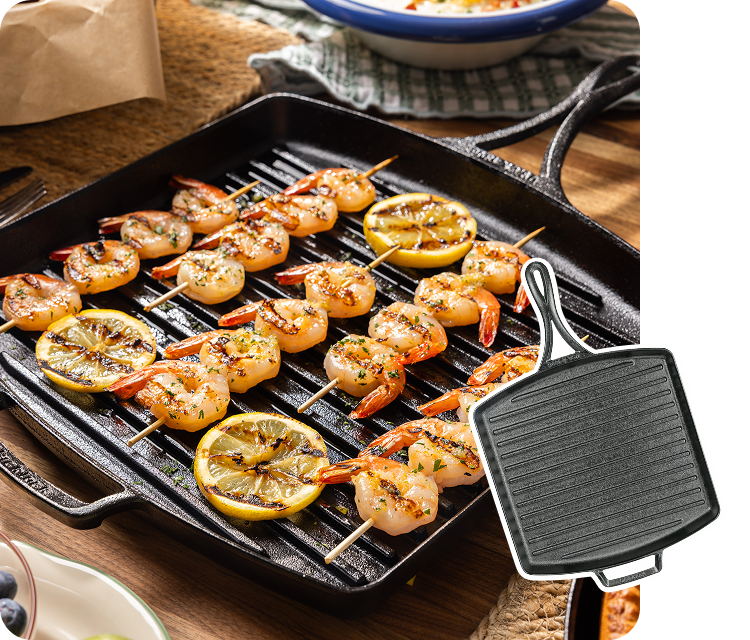 Grilled shrimp and lemon slices on a lightweight grill pan Grilled shrimp and lemon slices on a lightweight grill pan