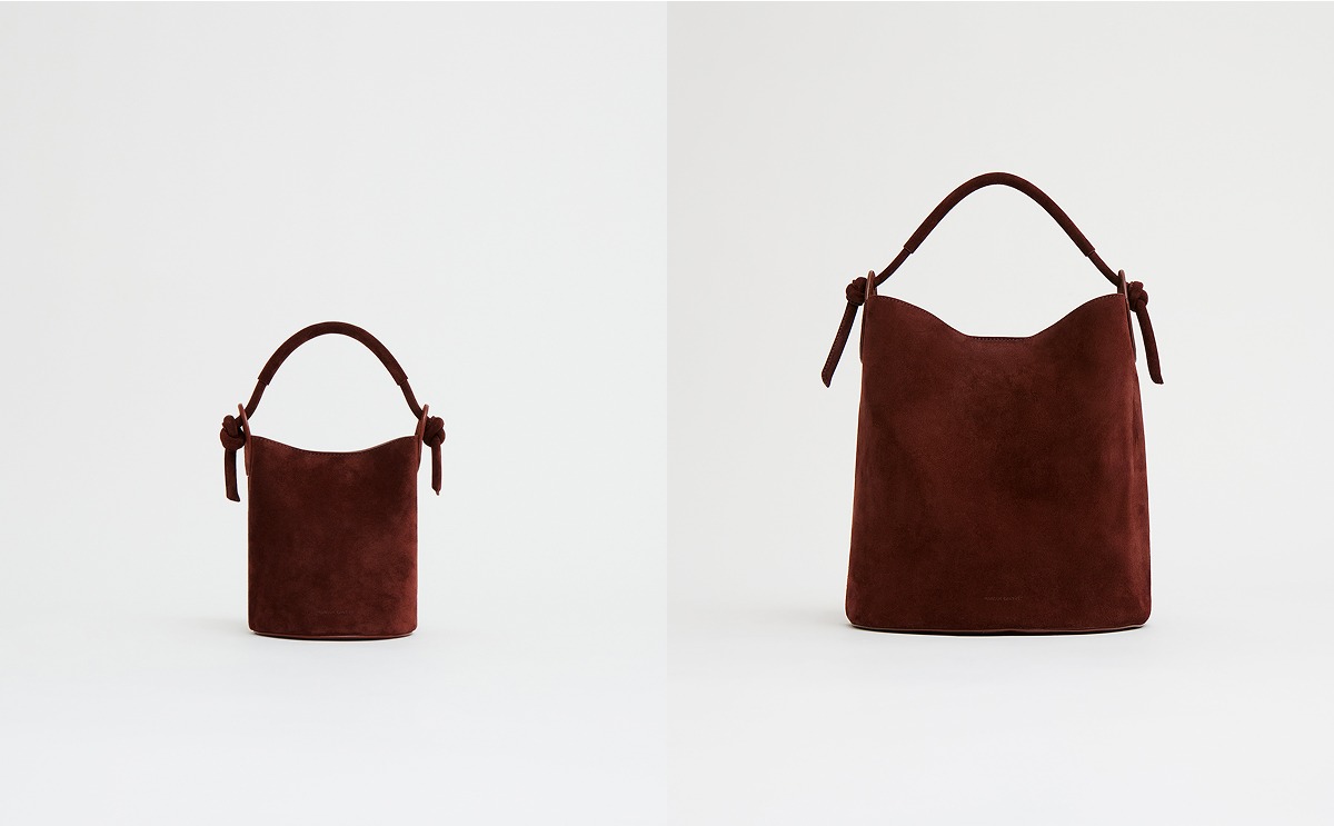 This modern silhouette features our signature knotted details, supple Italian suede, and a secure magnetic closure. Shop now.