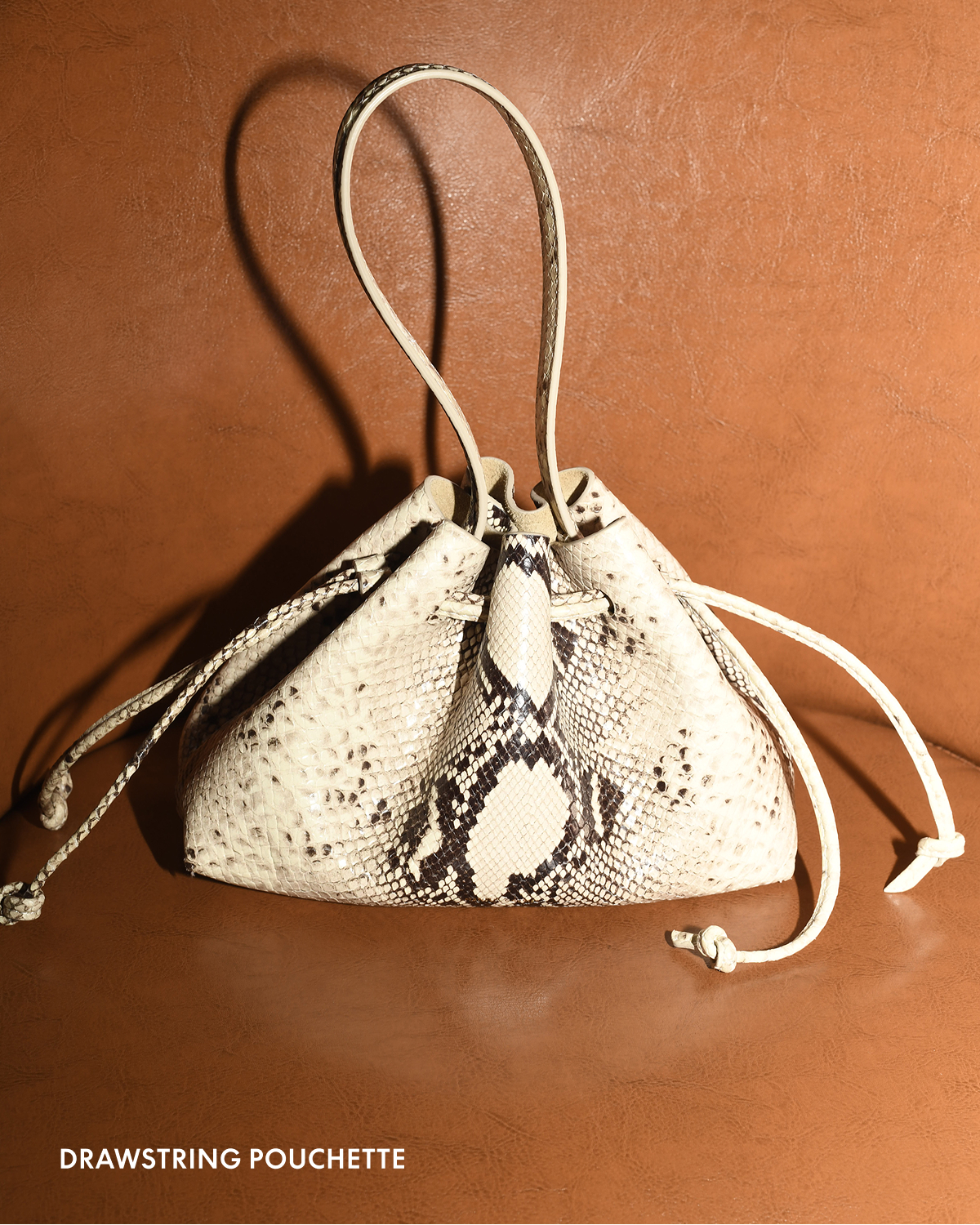 Texture in focus: snake print. Pictured: Drawstring Pouchette.
