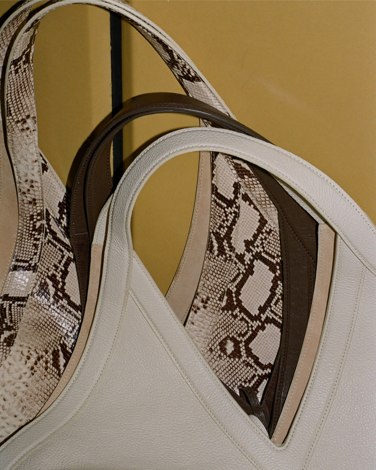Pictured: textures and color ways of the Soft M Tote.