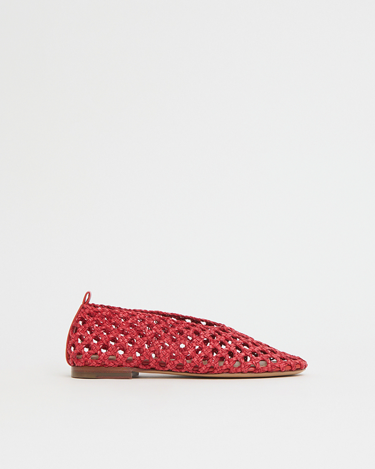 A lightweight flat defined by its woven construction and softly rounded shape.