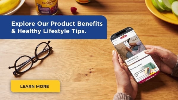 Woman With Smart Phone Reviewing Health Articles on NatureMade.com