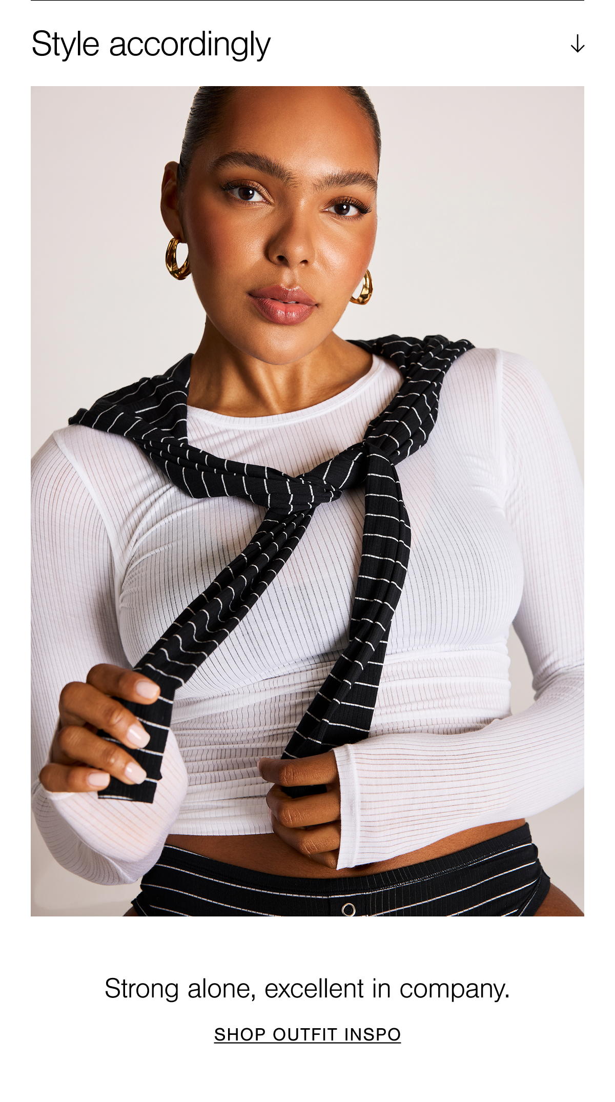 Model in the white Whipped Long Sleeve and Satellite French Cut Brief with a matching Whipped Long Sleeve in Satellite styled over shoulders.