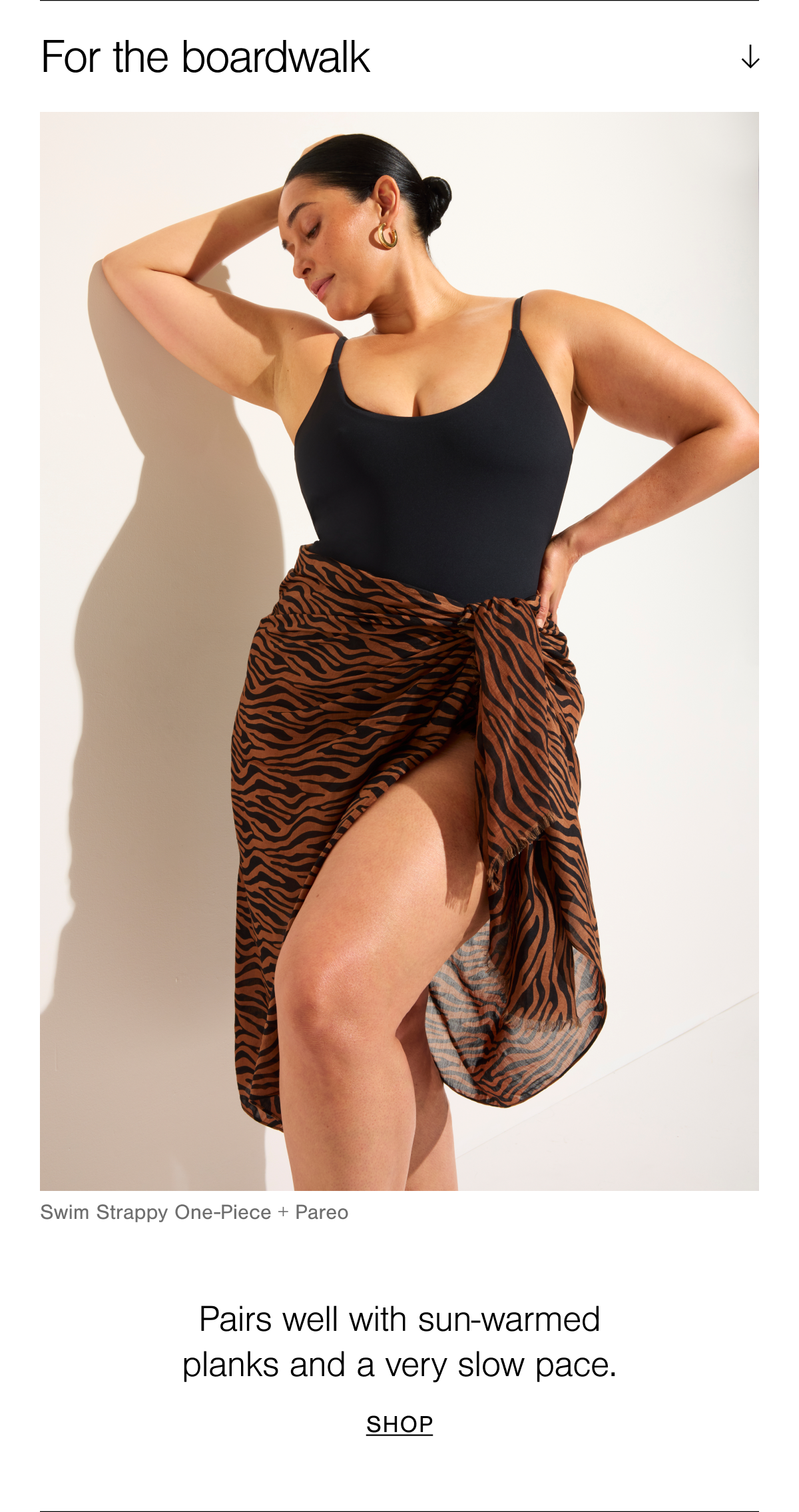 For the boardwalk, shop the Swim Strappy One-Piece in Black and Pareo in Tigre.