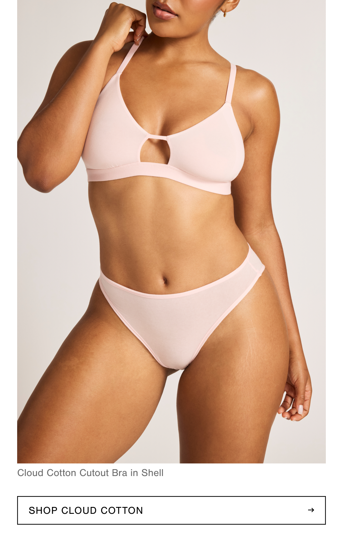 Introducing the Cloud Cotton Cutout Bra in Shell. Shell is a rose-tinted cherry blossom blush pink tone. Shop Cloud Cotton.