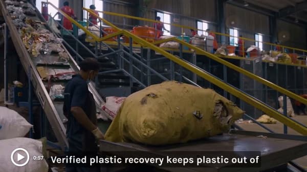 rePurpose Plastic Recovery Why Should Brands Fund Plastic Recovery? Video Logo on a image of a person pulling a pallet full of recyclables 