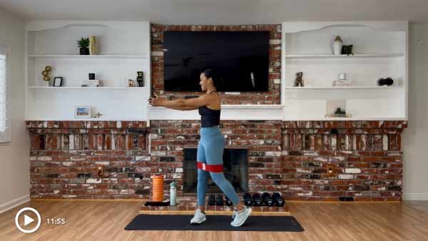 woman doing workout with exercise bands 