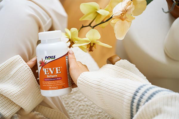 Eve Softgels in a woman's hand