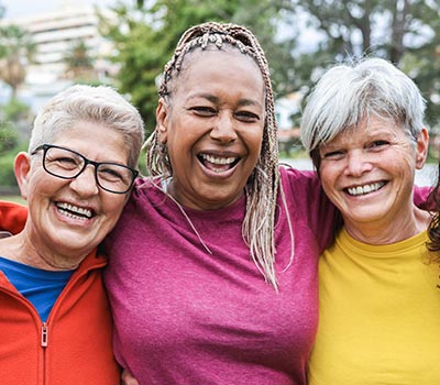 3 older women smiling 