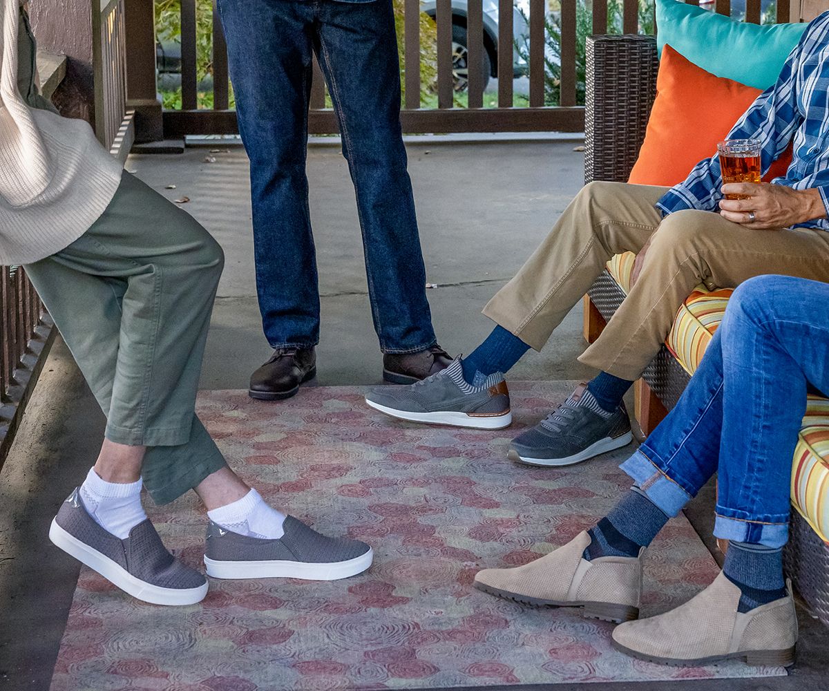 People outside gathering while wearing Dr Scholls socks