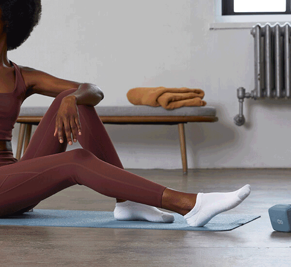 Images of people wearing athletic socks in different environments