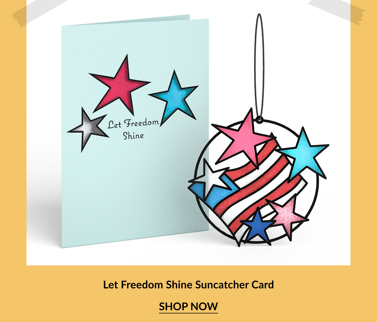 Light blue greeting card with red, blue, and silver stars and the phrase Let Freedom Shine, shown next to a matching circular suncatcher ornament with red and white stripes and colorful stars. Call-to-action below reads Let Freedom Shine Suncatcher Card – Shop Now.