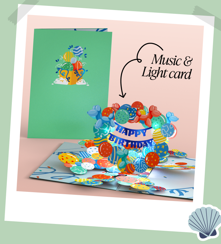 Birthday card with colorful balloons on the cover and a matching 3D pop-up balloon display inside. Lights and music are featured. Label reads Music & Light card with a shell icon in the corner and taped photo frame style.
