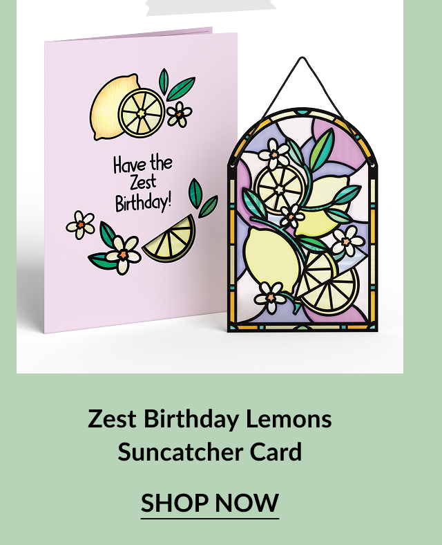 Pink birthday card with lemons, limes, and blossoms and the message Have the Zest Birthday, next to a matching suncatcher with yellow lemons and green leaves in a stained glass style. Call-to-action below reads Zest Birthday Lemons Suncatcher Card – Shop Now.