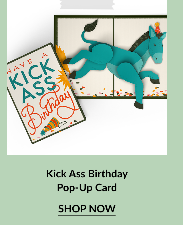 Bold birthday card with colorful text reading Have a Kick Ass Birthday and an image of a party hat. Inside reveals a playful 3D pop-up of a teal donkey kicking through confetti. Call-to-action below reads Kick Ass Birthday Pop-Up Card – Shop Now.