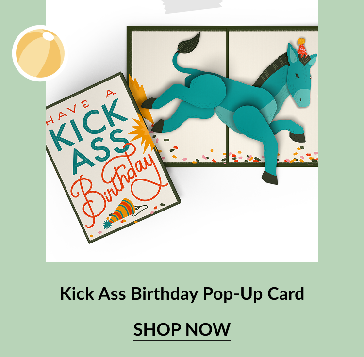 Bold birthday card with colorful text reading Have a Kick Ass Birthday and an image of a party hat. Inside reveals a playful 3D pop-up of a teal donkey kicking through confetti. Call-to-action below reads Kick Ass Birthday Pop-Up Card – Shop Now.
