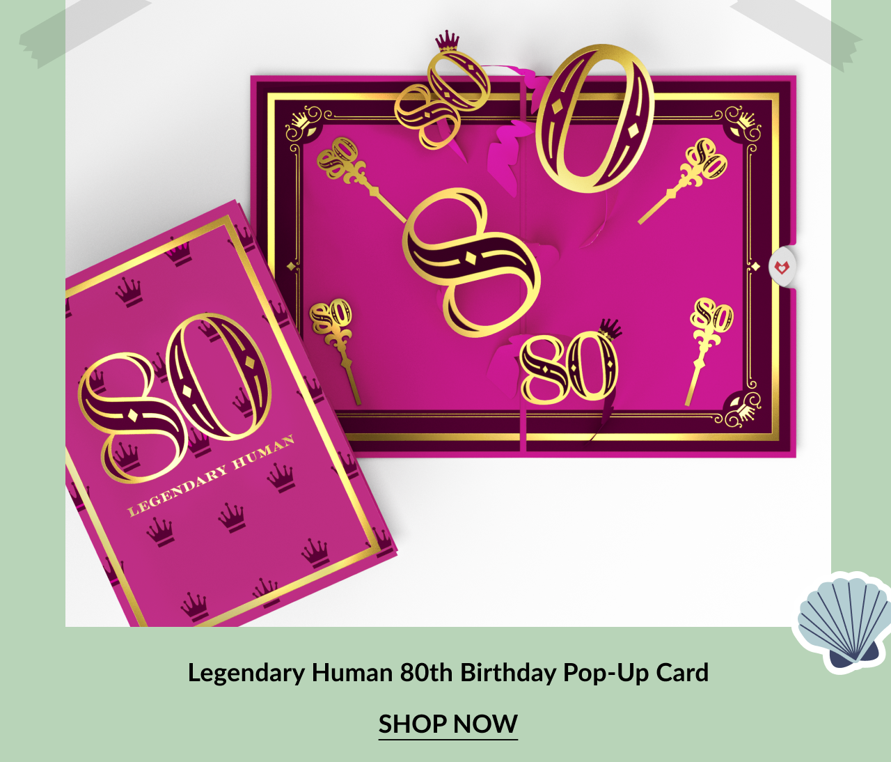 Bright pink and gold pop-up card with the number 80 and crown icons. The front reads Legendary Human. Inside features a 3D pop-up of golden 80s and decorative keys. Call-to-action below reads Legendary Human 80th Birthday Pop-Up Card – Shop Now.