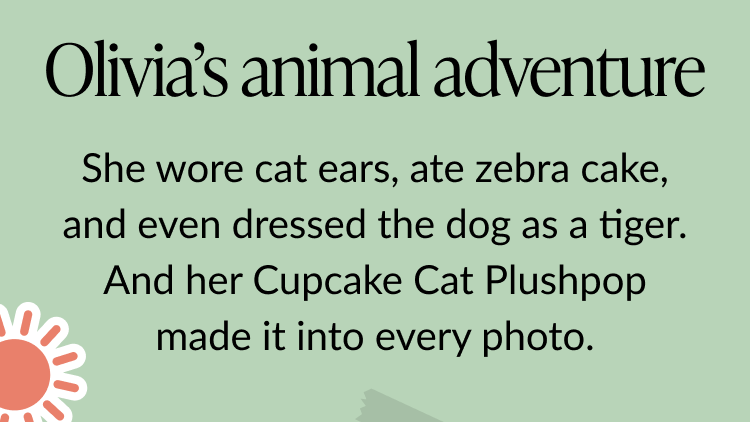 Message on a soft green background reads Olivia’s animal adventure followed by She wore cat ears, ate zebra cake, and even dressed the dog as a tiger. And her Cupcake Cat Plushpop made it into every photo.