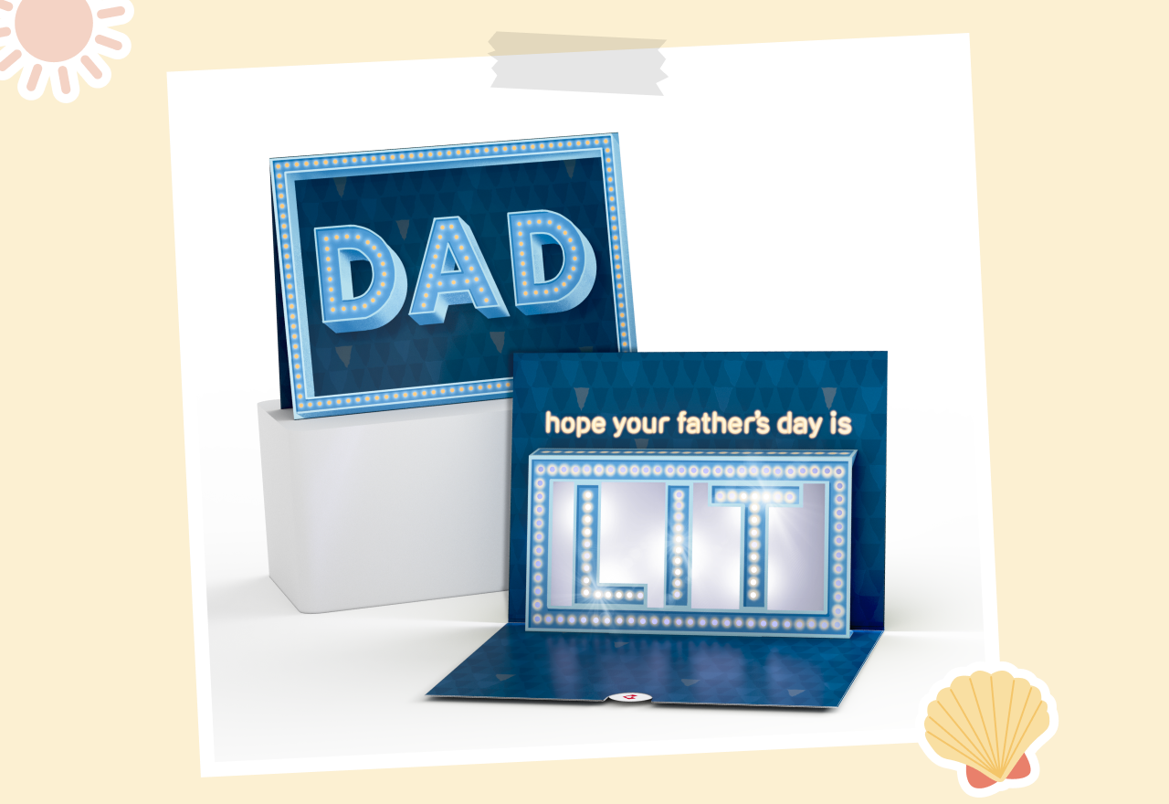 Father’s Day card with a light-up marquee theme. The cover displays the word DAD in glowing lights, and the inside message reads hope your father’s day is LIT with illuminated letters.