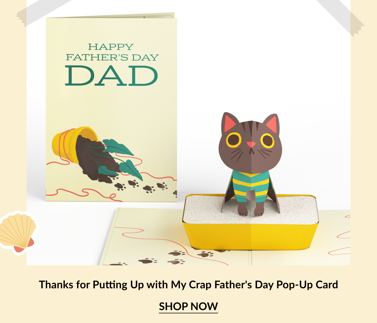 Humorous Father’s Day pop-up card featuring a cartoon cat with yellow eyes and a striped sweater. The cover reads Happy Father’s Day Dad with a tipped-over trash can. Call-to-action below reads Thanks for Putting Up with My Crap Father's Day Pop-Up Card – Shop Now.