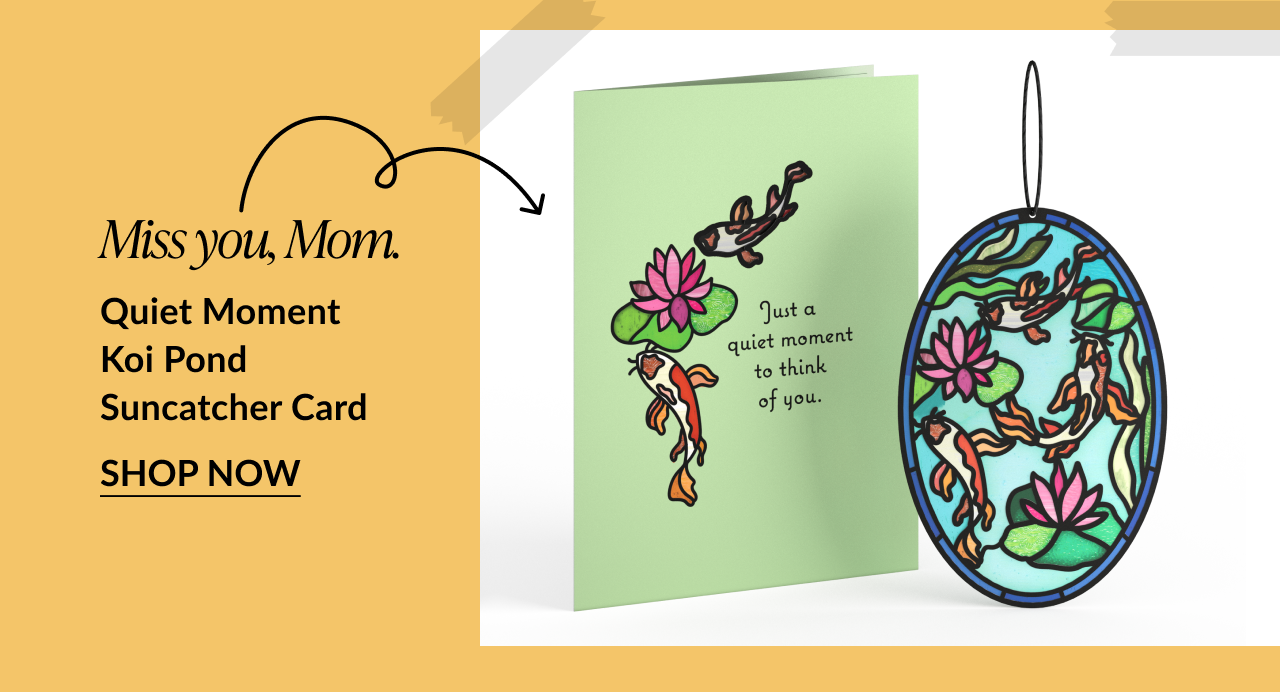 Illustrated card with koi fish and lily pads next to a matching koi pond suncatcher. Card reads: 'Just a quiet moment to think of you.' Text below says: 'Miss you, Mom. Quiet Moment Koi Pond Suncatcher Card.' Button reads 'Shop Now.