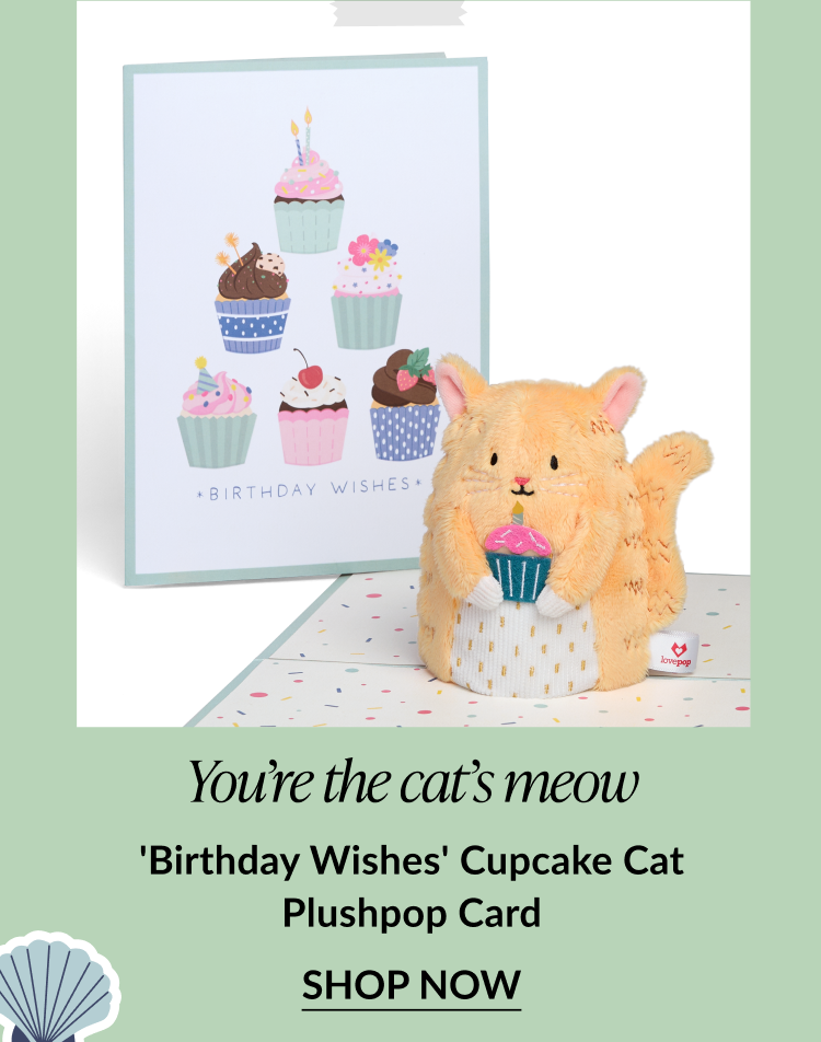 Orange cat Plushpop with a cupcake, shown with a card decorated with birthday cupcakes.