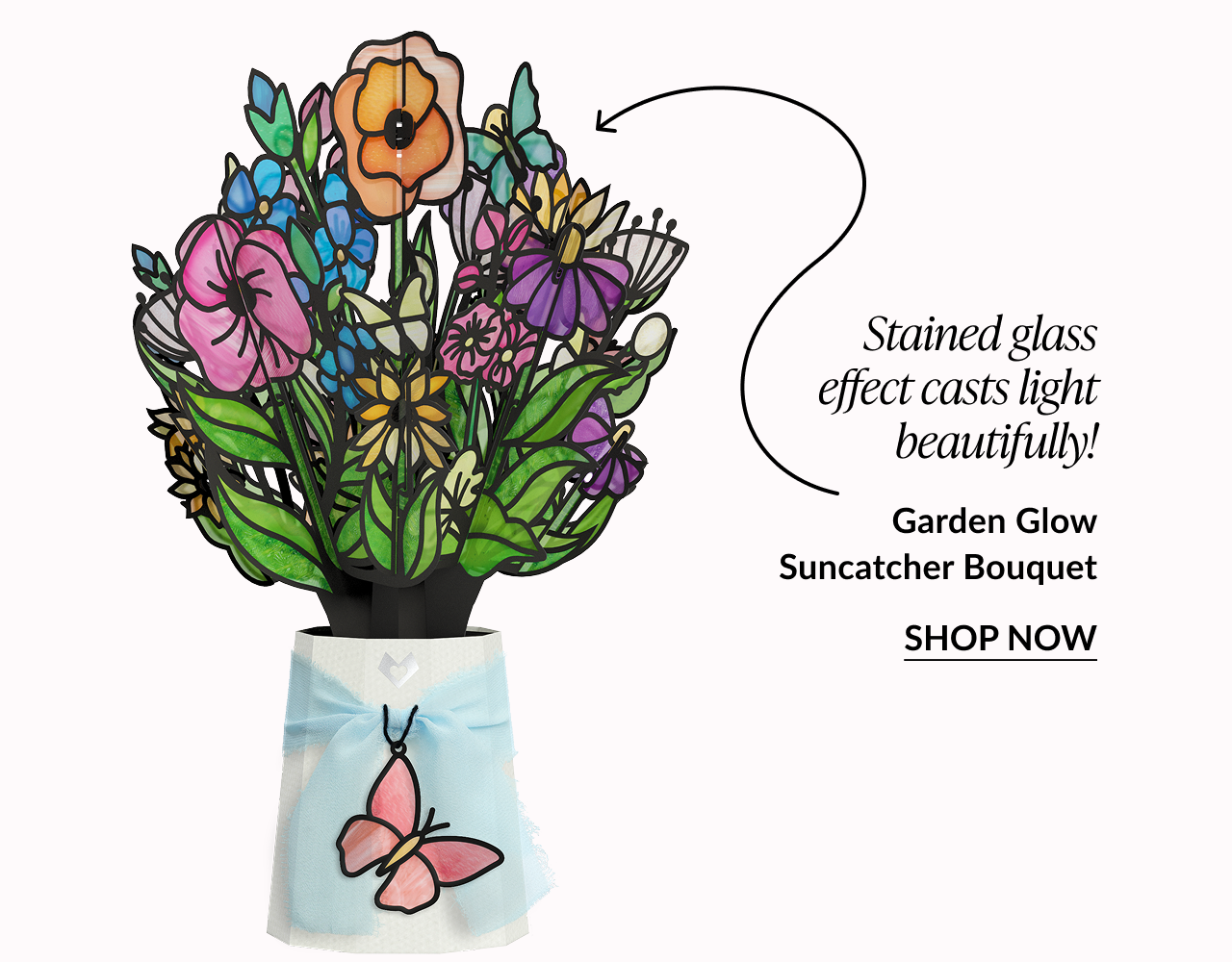 Bright mixed-flower suncatcher bouquet with butterfly charm and stained-glass effect.