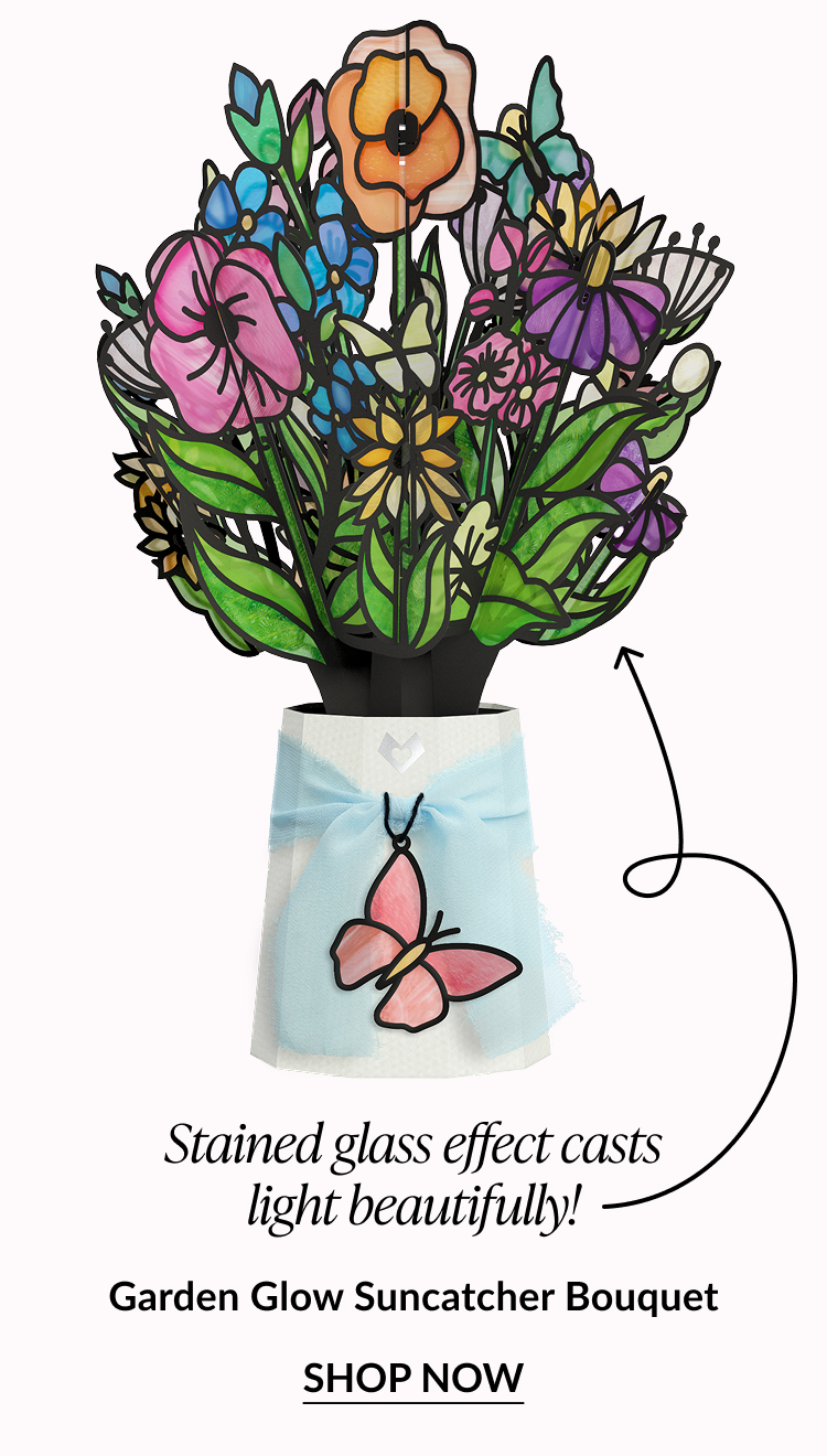 Bright mixed-flower suncatcher bouquet with butterfly charm and stained-glass effect.