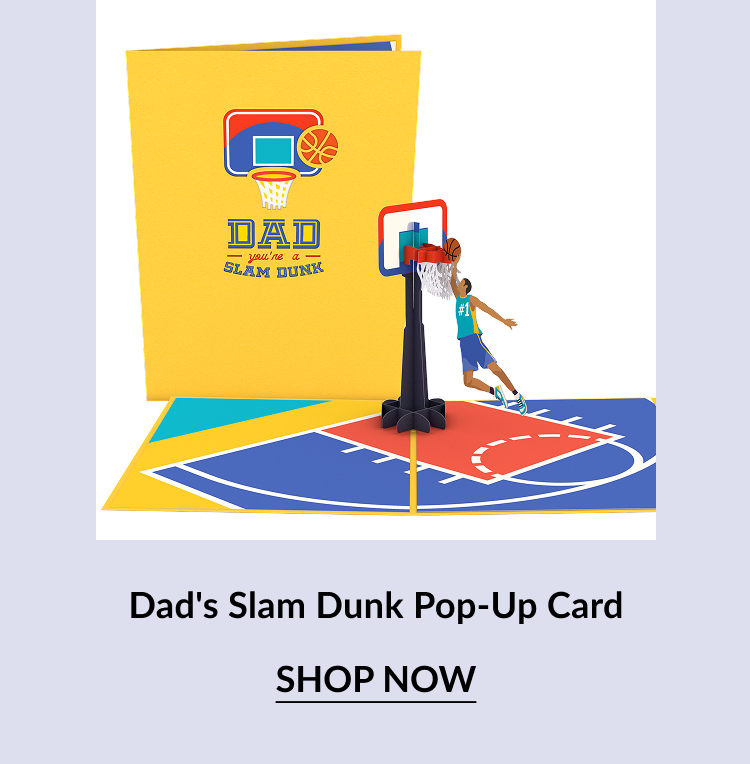 Product image of the ''Dad's Slam Dunk Pop-Up Card.'' The yellow cover shows a basketball hoop and ball graphic with the text ''DAD you're a SLAM DUNK.'' Inside, a 3D basketball hoop with a dunking player pops up over a court illustration.