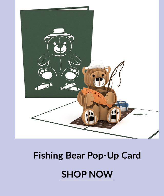 Pop-up card with a smiling bear holding a fish, sitting on a dock. The front cover shows a white outline of the bear holding two fish. Call-to-action button says ''SHOP NOW.'' 5️⃣