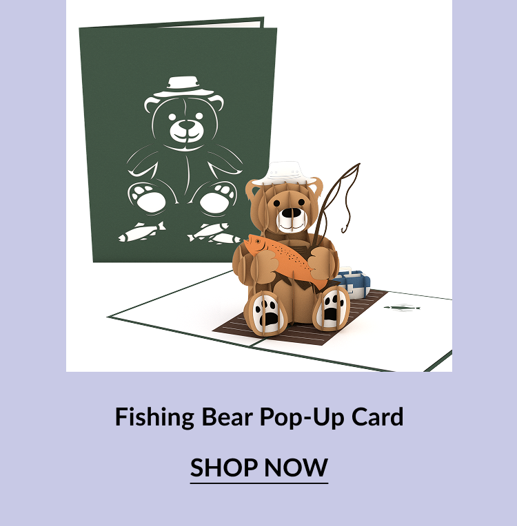 Pop-up card with a smiling bear holding a fish, sitting on a dock. The front cover shows a white outline of the bear holding two fish. Call-to-action button says ''SHOP NOW.'' 5️⃣