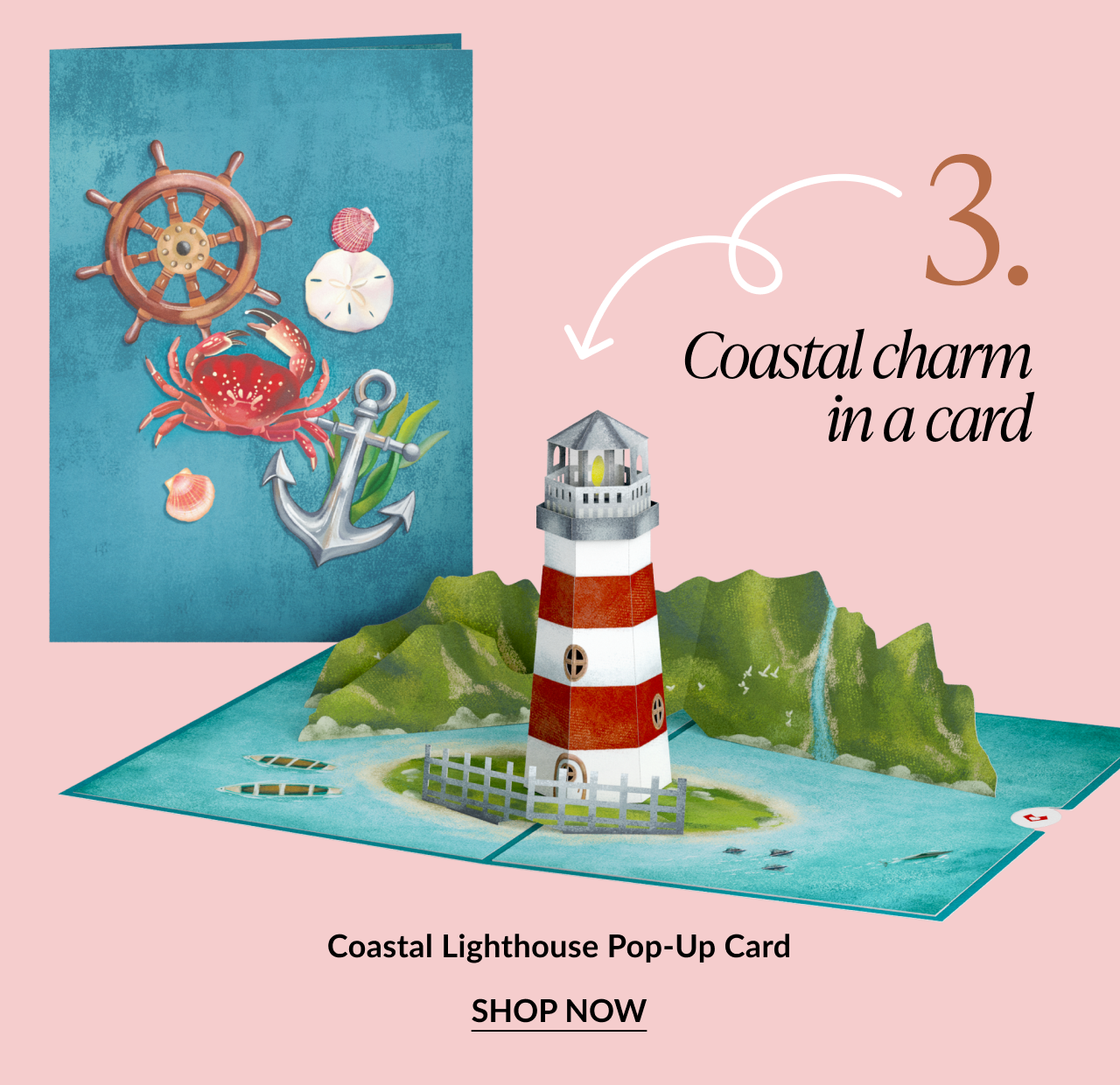 Pop-up card featuring a red and white striped lighthouse on a coastal island. Text reads: Coastal charm in a card. Coastal Lighthouse Pop-Up Card. SHOP NOW.