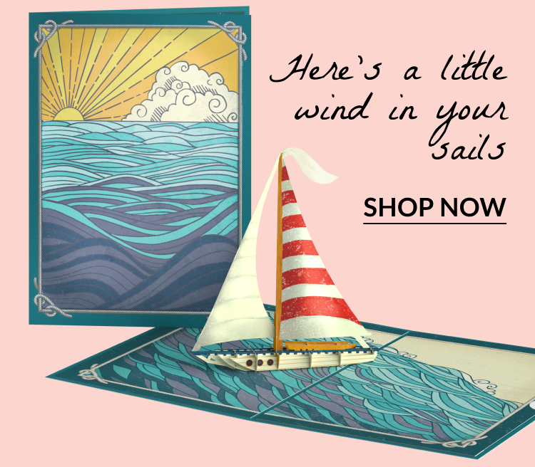 Pop-up sailboat card; text reads “Here’s a little wind in your sails.”