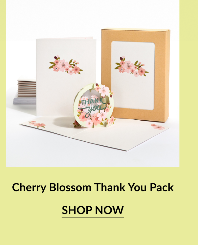 Cherry Blossom-themed thank-you card set including flat and pop-up cards, kraft paper box, and envelopes. All items feature light pink cherry blossoms with green leaves.