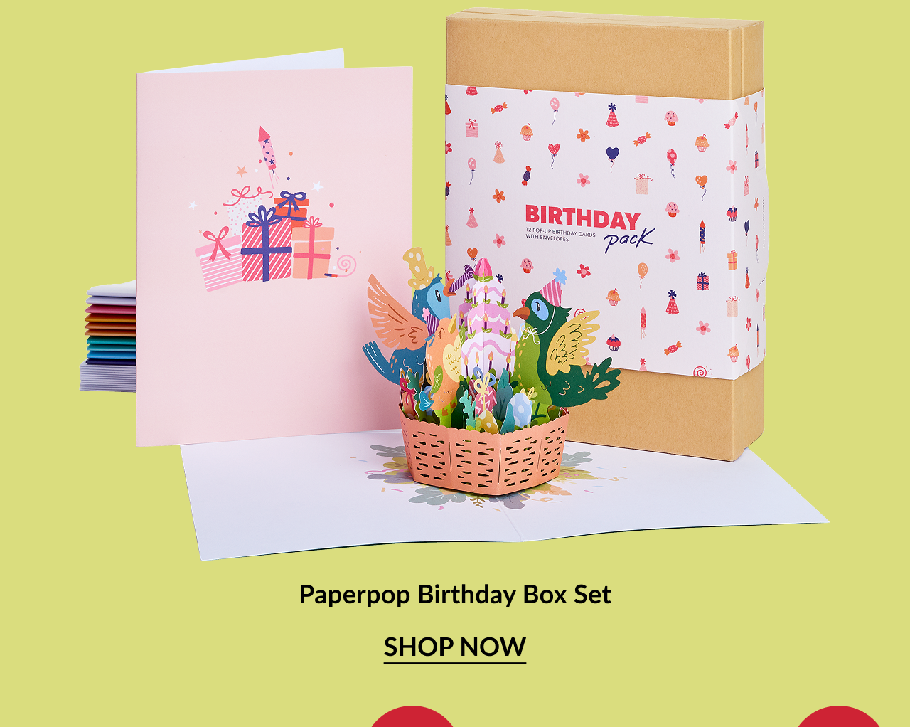 Colorful birthday-themed card set with pastel pink front card and vibrant 3D pop-up basket filled with birds and gifts. Box labeled ''BIRTHDAY pack'' with cheerful party icons.