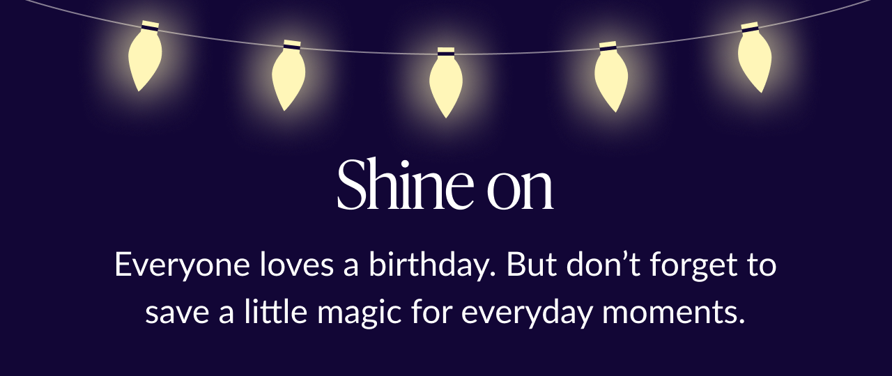 Dark background with glowing string lights and text 