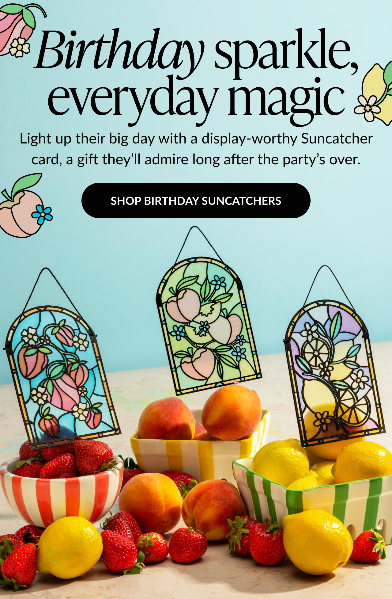 Birthday Suncatchers Promo with fruit-themed suncatcher cards displayed among lemons, peaches, and strawberries. Text reads: 