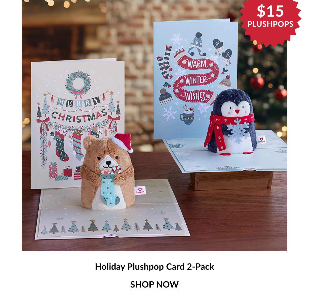 Two pop-up holiday cards featuring a plush bear and a plush penguin, with festive backgrounds.