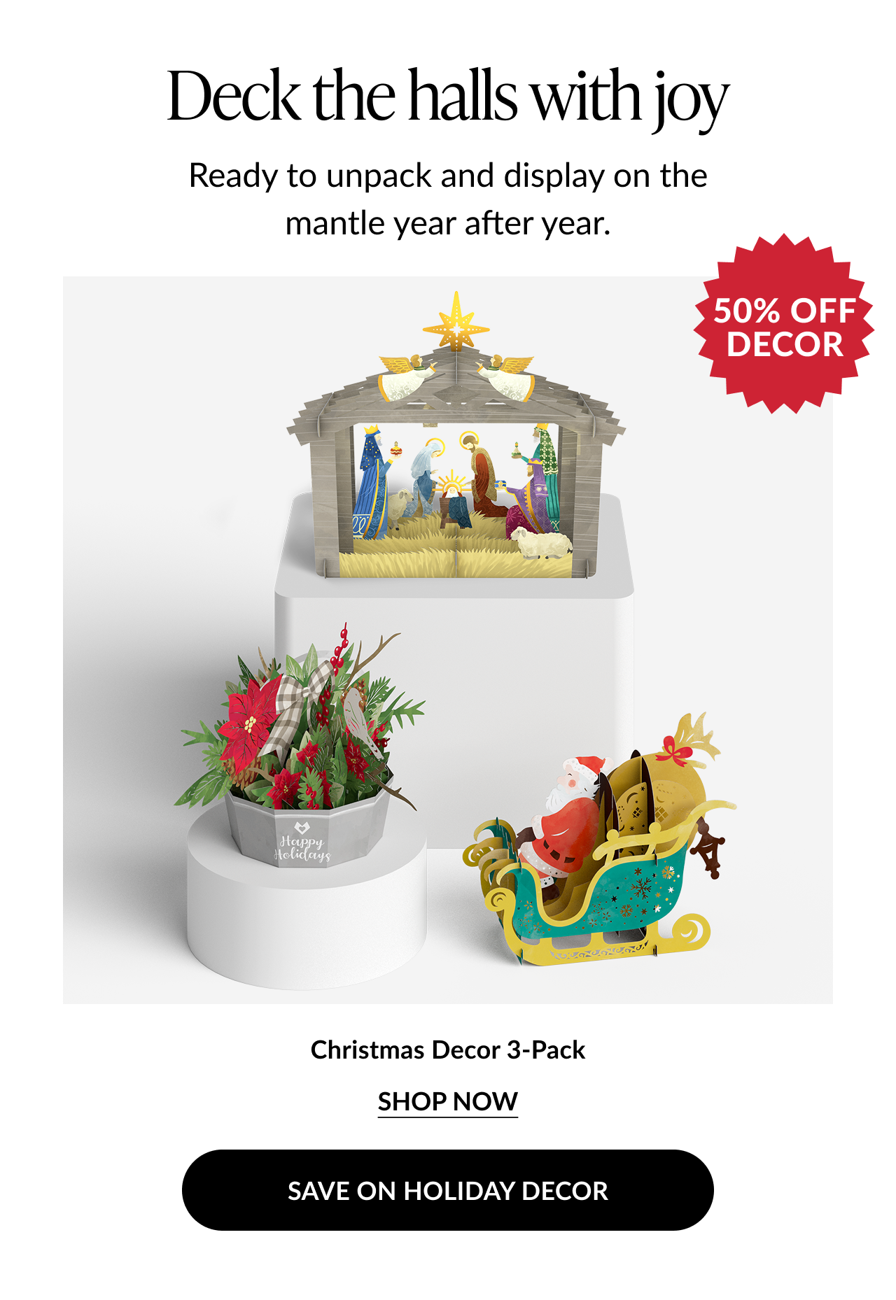 Christmas Decor 3-Pack featuring a nativity scene, poinsettia arrangement, and Santa in a sleigh pop-up display with a “50% Off Decor” badge.