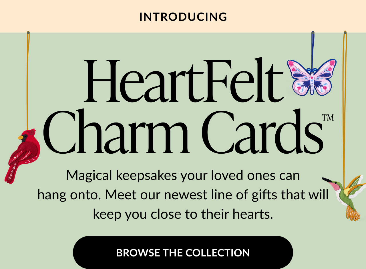 Banner introducing HeartFelt Charm Cards with illustrations of a cardinal, butterfly, and hummingbird charms hanging on strings.