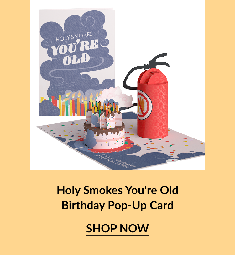 Pop-up birthday card with a cake surrounded by lit candles and a fire extinguisher.